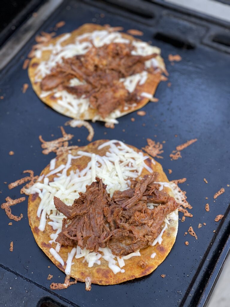 Tacos being assembled on the Traeger Ranger
