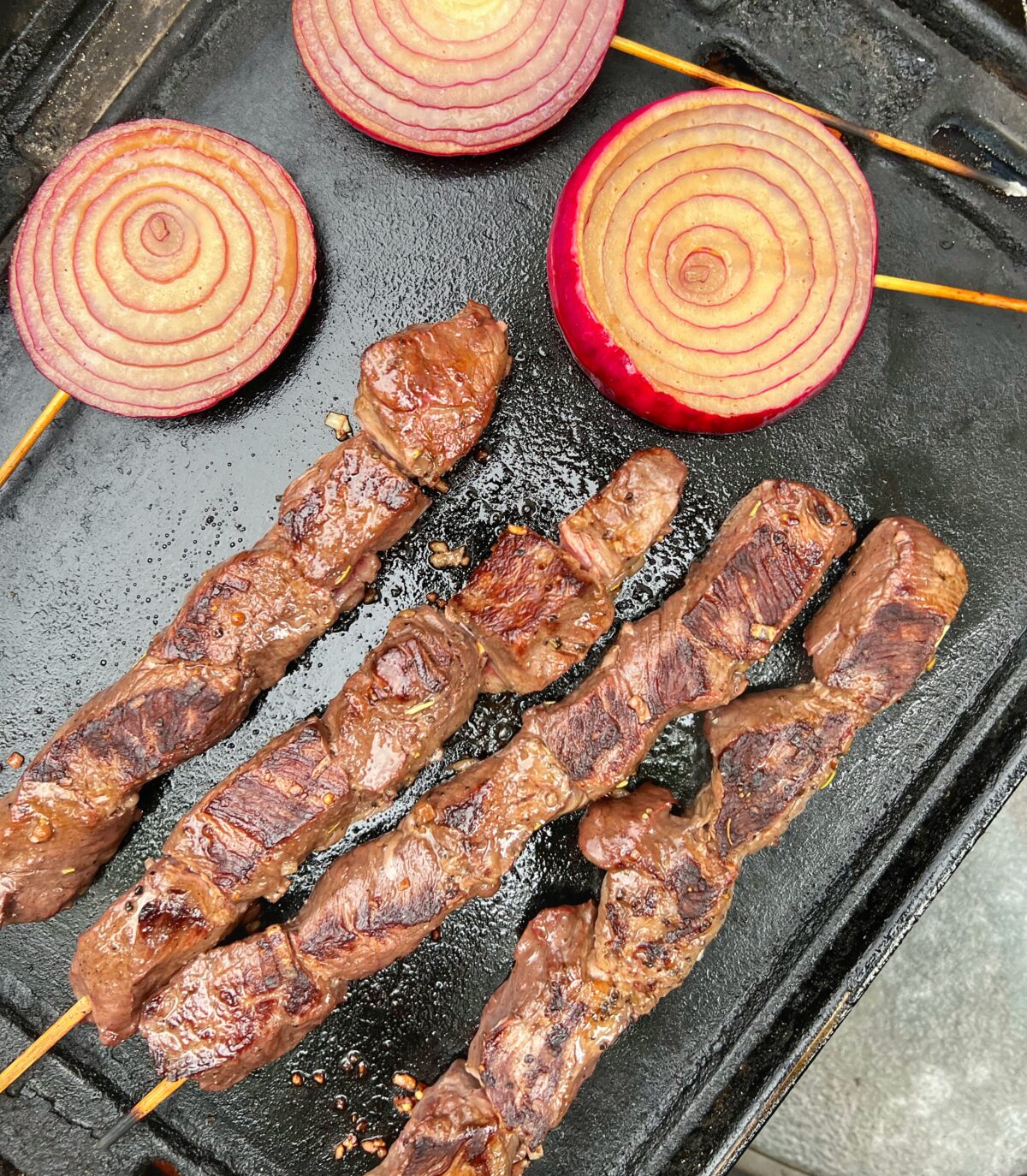 Skewers and onions on the grill