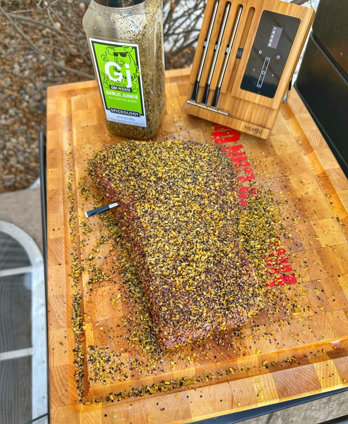 Corned beef seasoned with Garlic Junkie on a cutting board.