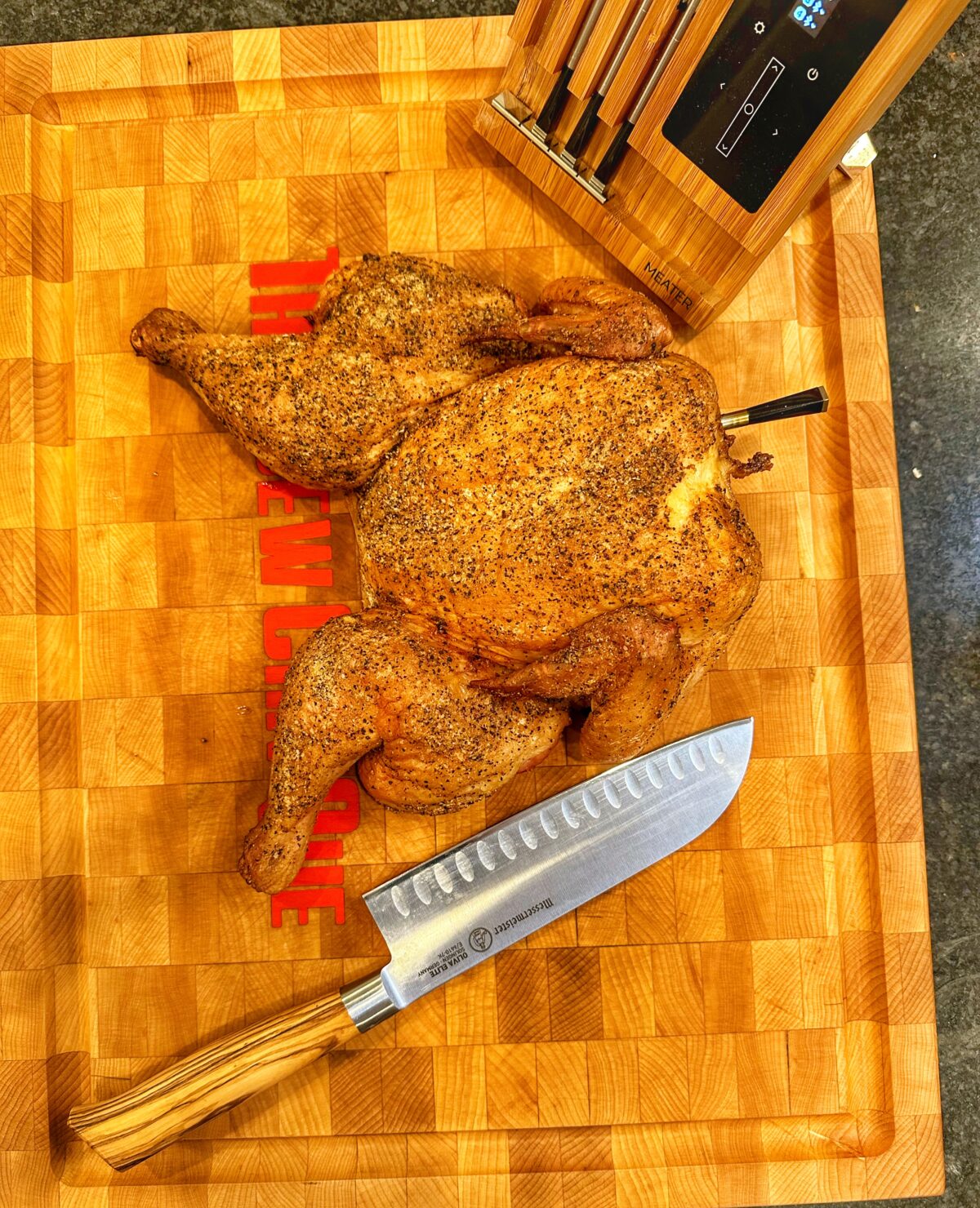 Cooked chicken on a cutting board.