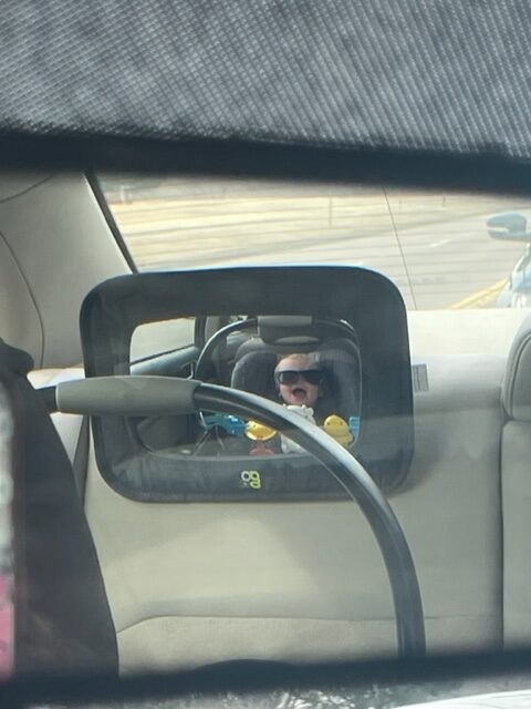 Photo of child in carseat.