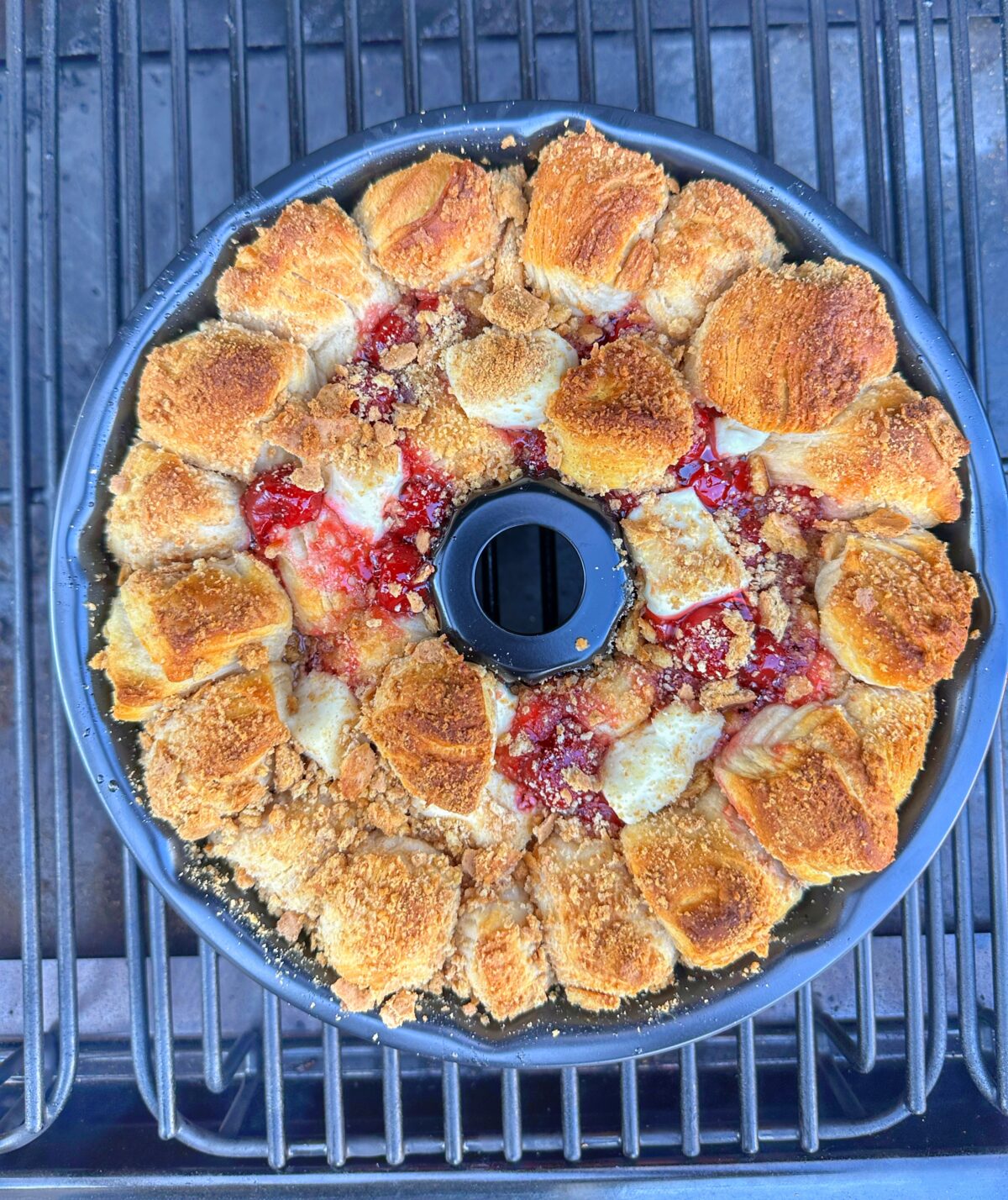 Cherry Cheesecake Monkey Bread baking in the Traeger.