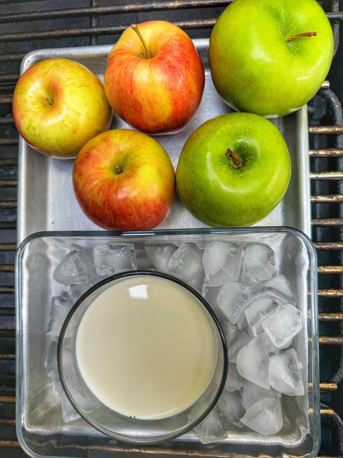 Apples and heavy cream on a cookie sheet smoking.
