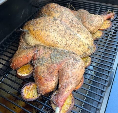 A turkey in a Traeger grill.