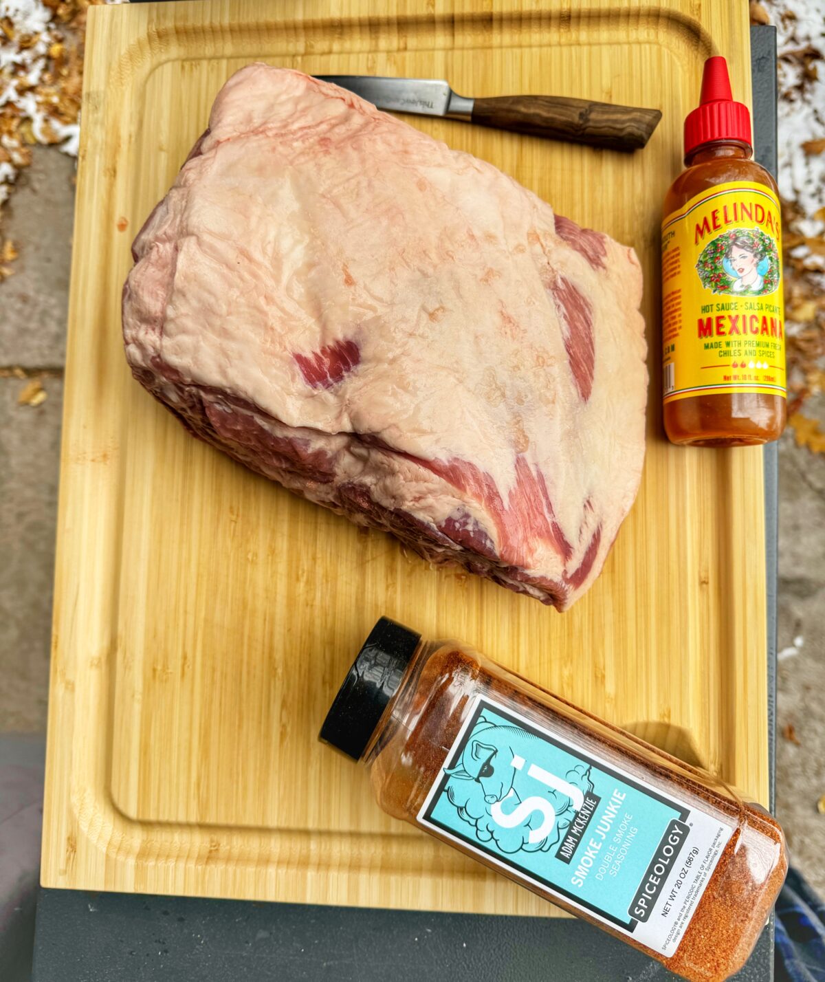 Ingredients for pulled pork on a cutting board.