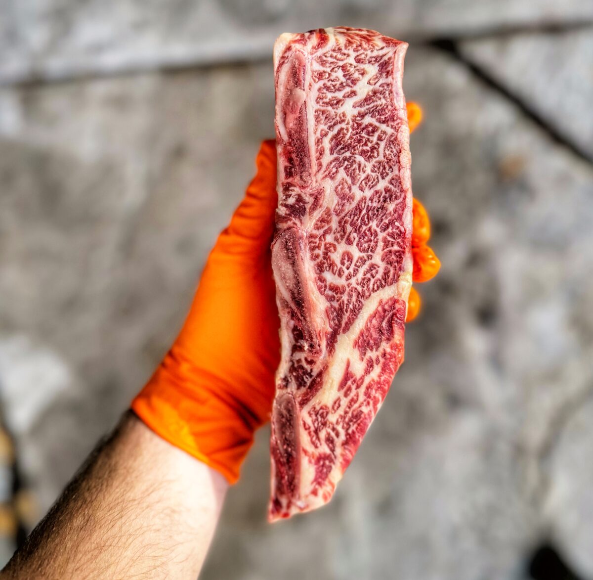 A marbled beef short rib before seasoning.