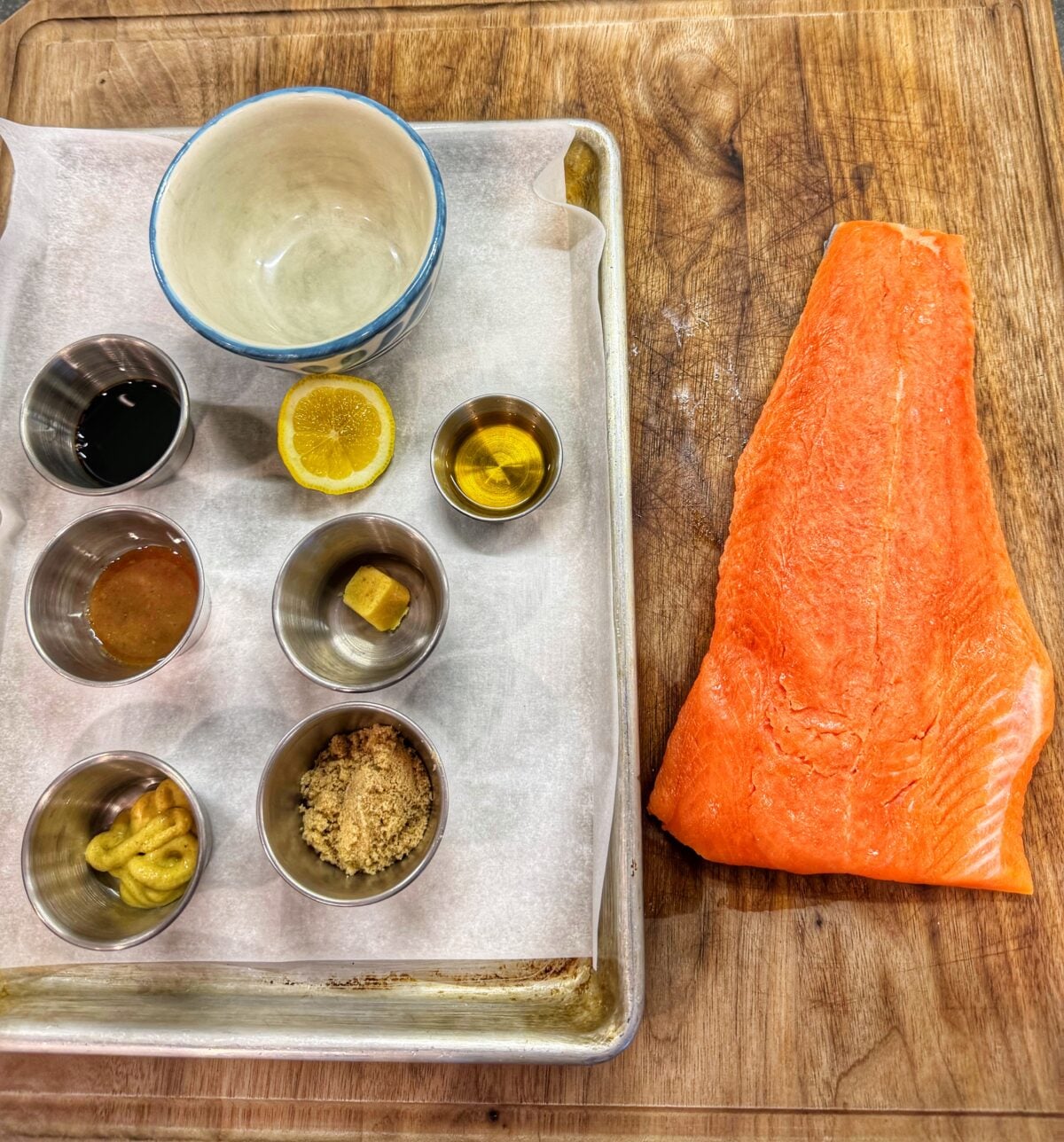 Salmon filet with bourbon, brown sugar, Dijon mustard, soy sauce, garlic, lemon, and Worcestershire sauce arranged for bourbon brown sugar salmon.