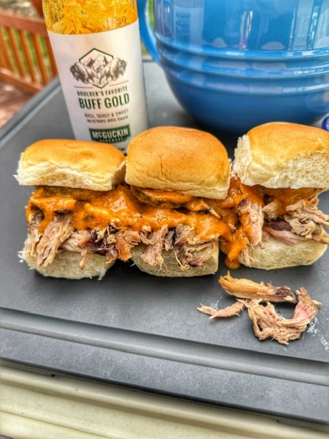 Smoked pulled pork sliders topped with McGuckin Hardware Buff Gold barbecue sauce.