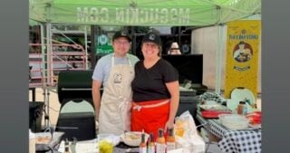 ThisJewCanQue team standing behind the outdoor grilling demo table at McGuckin Hardware in Boulder, Colorado.