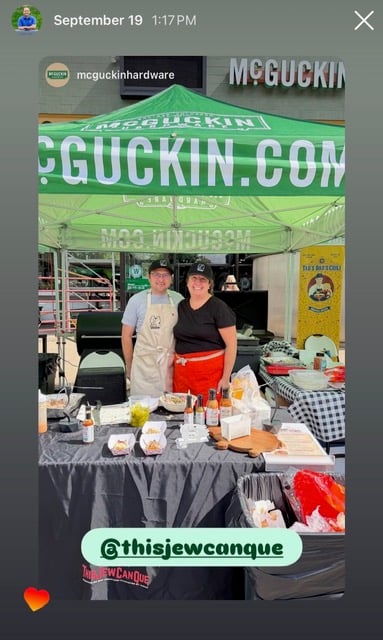 ThisJewCanQue team standing behind the outdoor grilling demo table at McGuckin Hardware in Boulder, Colorado.
